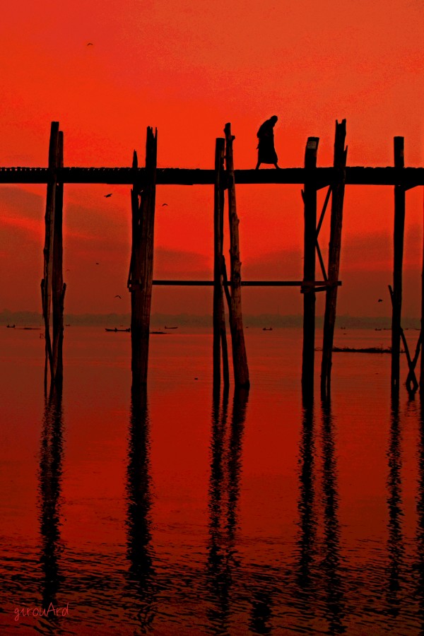 Monk crossing U-Bein bridge Print